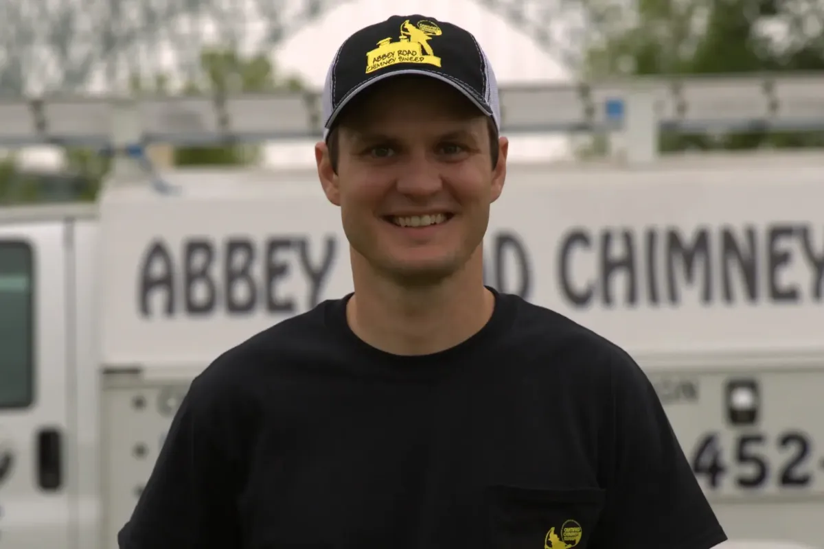 Timothy Weaver, owner of Abbey Road Chimney Sweep, in front of a company van