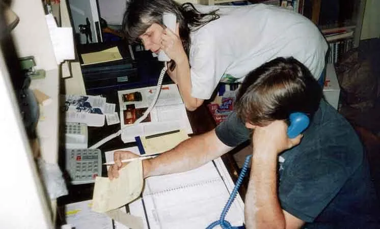 Founders Doug and Irma Ault taking calls in the early days of Abbey Road Chimney Sweep