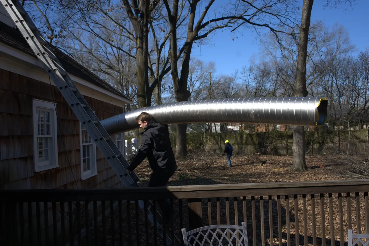 Chimney damage being documented for an insurance claim