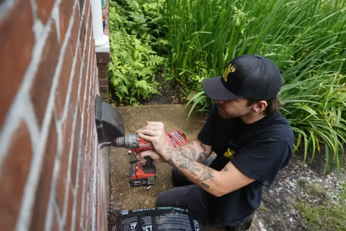 Abbey Road technician installing a pest-proof dryer-vent cap in Memphis